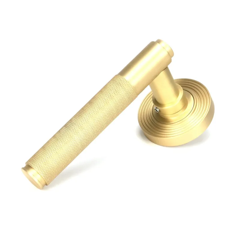 Satin Brass Brompton Lever on Rose Place (Beehive) | From Anvil