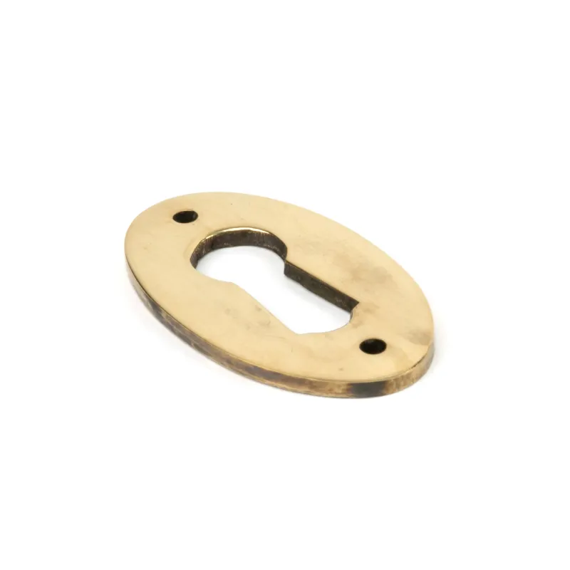 Aged Warm alloy Oval Escutcheon | From Anvil